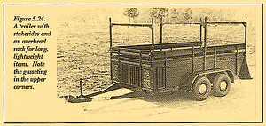 A trailer with stakesides and an overhead rack for long, lightweight items. Note the gusseting in the upper corners. 